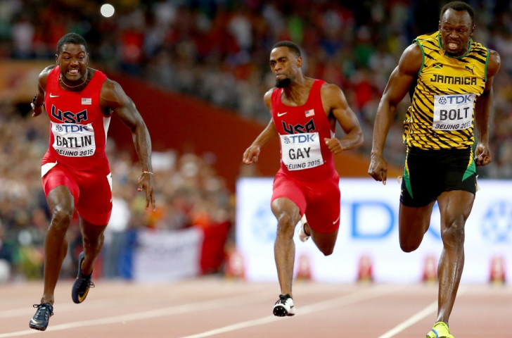 Usain Bolt (right) retains his world 100m title in what he called his 'hardest race' as he finishes in 9.79sec ahead of silver medallist Justin Gatlin, the fastest this year, who clocked 9.80 ©Getty Images