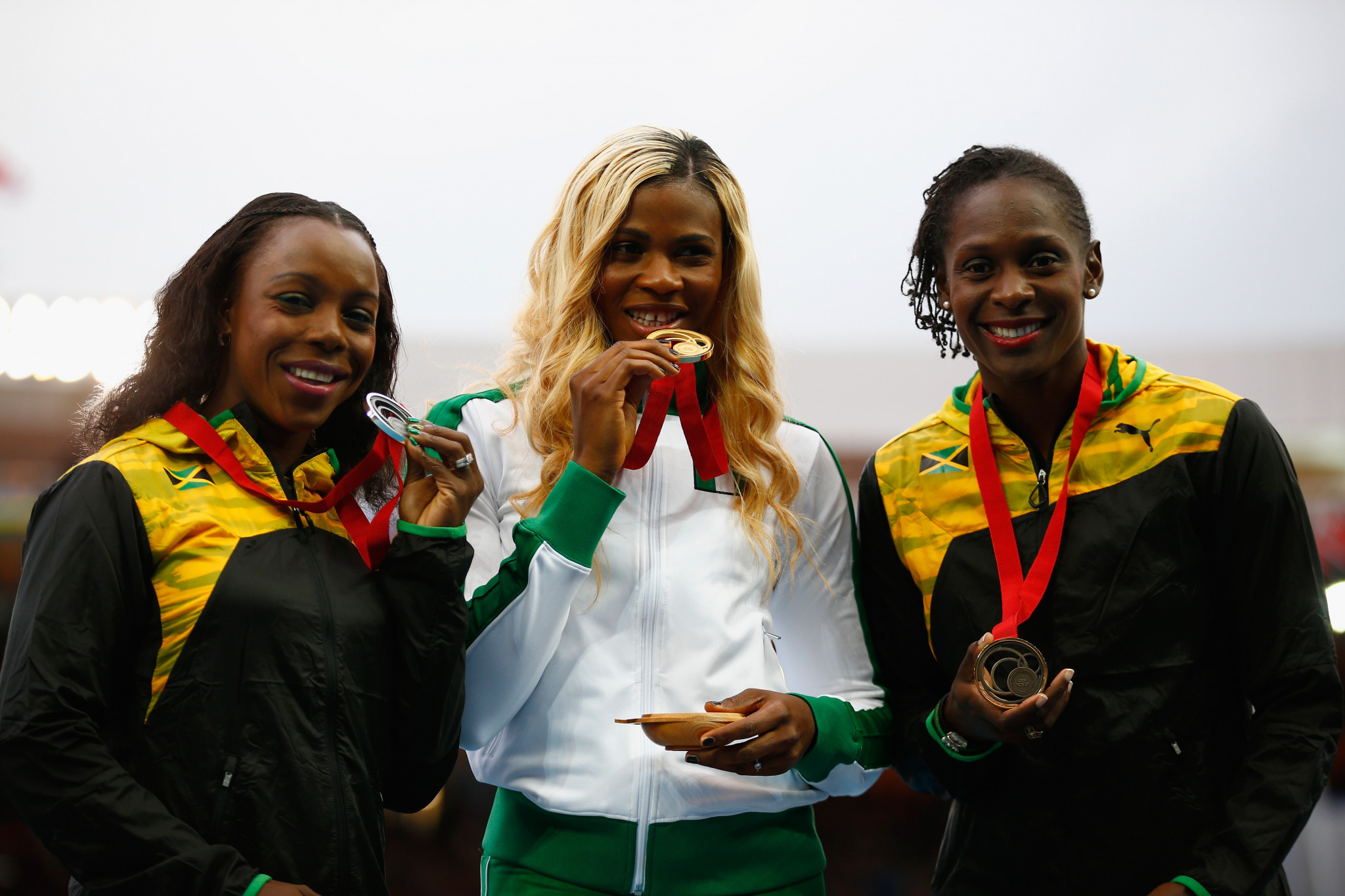 Blessing Okagbare, centre, who won two gold medals at the 2014 Commonwealth Games in Glasgow, will be one of Nigeria's biggest hopes in Gold Coast ©Getty Images 
