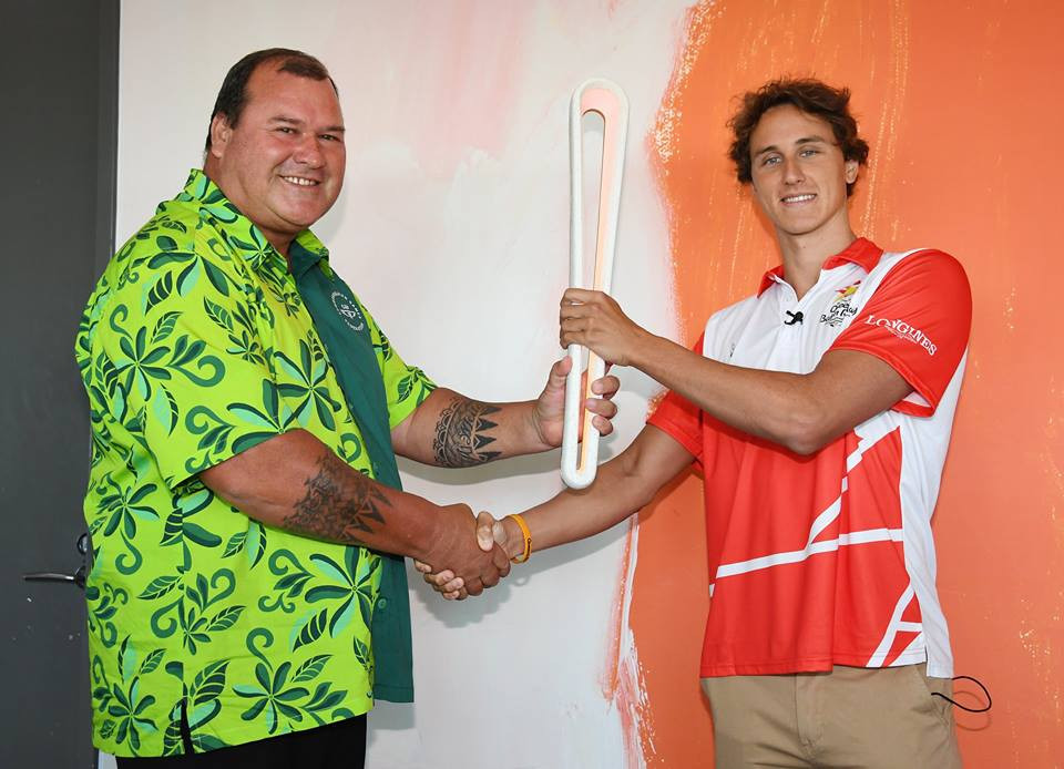 Hugh Graham, the Commonwealth Games Federation's regional vice president for Oceania, hands over the Baton to Cameron McEvoy ©Gold Coast 2018/Facebook