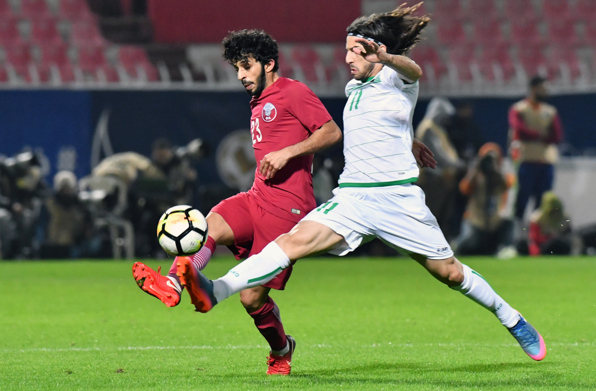Iraq's midfielder Humam Tariq, right, vies for the ball against Qatar's midfielder Hamad Al-Abedy during their 2017 Gulf Cup of Nations group match at Al Kuwait Sports Club Stadium in Kuwait City ©Getty Images