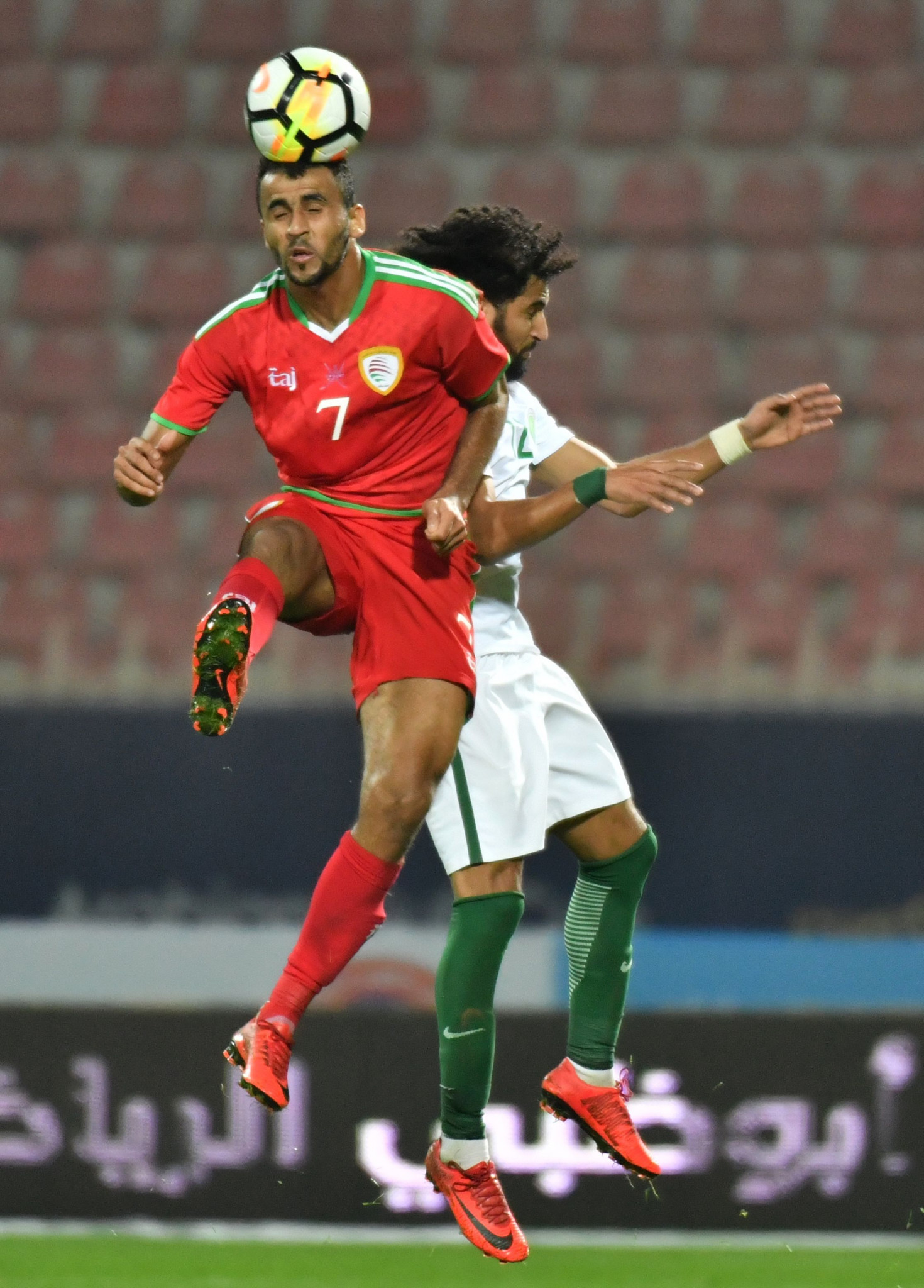 Oman's Khalid al-Hajri, left, and Saudi Arabia's Abdurahman al-Obaid vie for the ball during the 2017 Gulf Cup of Nations clash in Kuwait City ©Getty Images