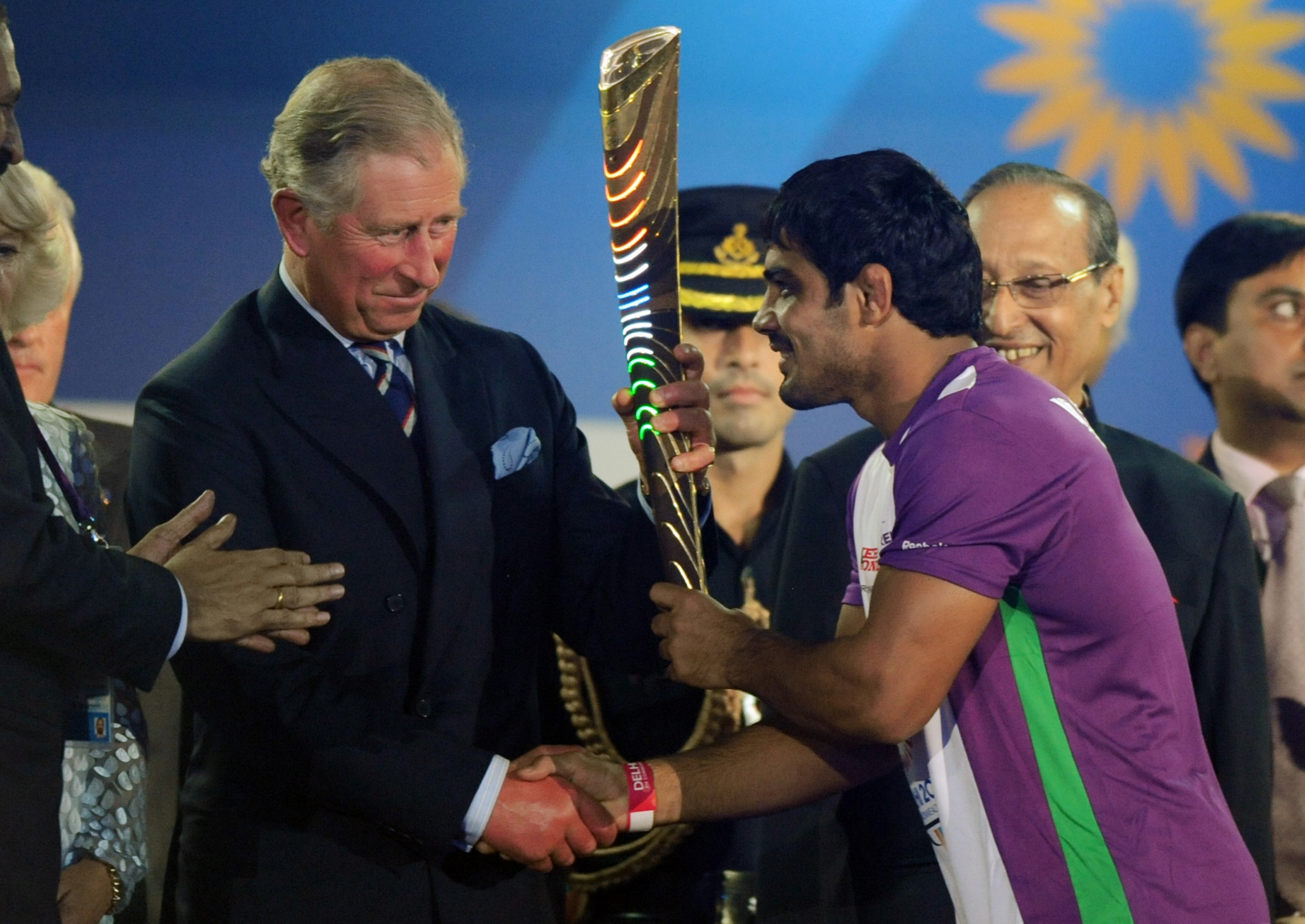 Prince Charles, the Prince of Wales, receives the Queen's Baton from Indian wrestler Sushil Kumar at the XIX Commonwealth Games opening ceremony in New Delhi in 2010. The Prince will again play a leading role in Gold Coast ©Getty Images