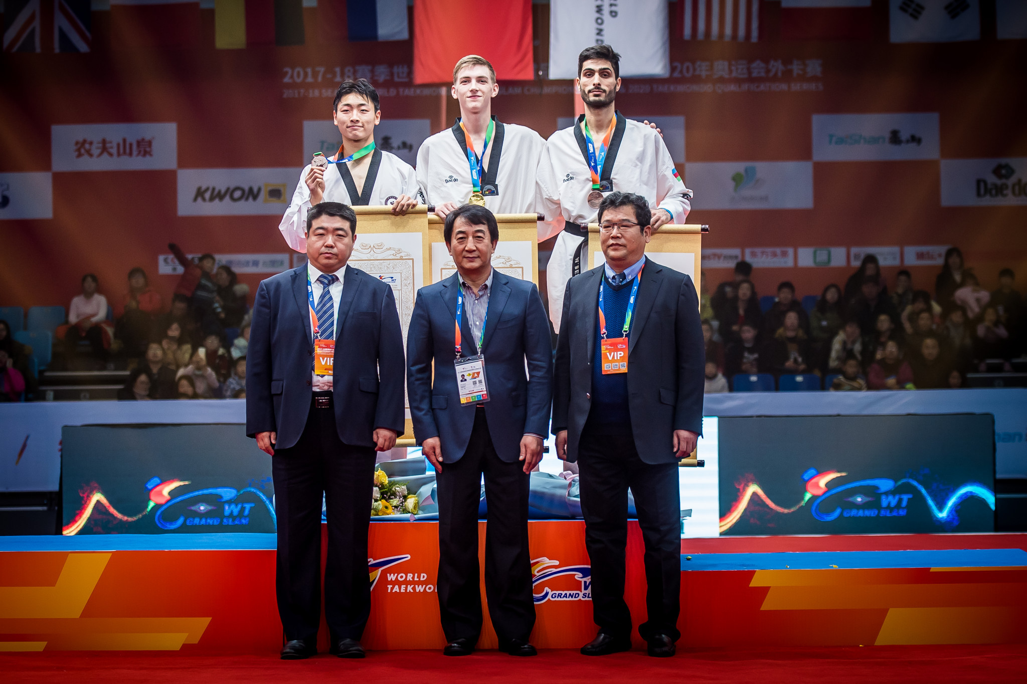 Azerbaijan's reigning world champion Milad Beigi Harchegani, back right, completed the top three ©World Taekwondo