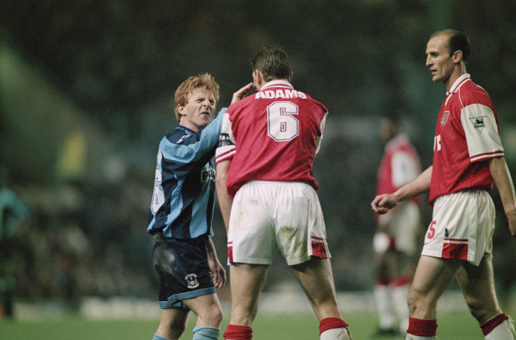 Coventry City's Gordon Strachan has a wee word with Arsenal's captain Tony Adams during their league game in April 1997 - seven months before a meeting in the Coca Cola Cup that was memorable for the pre-match atmosphere ©Getty Images