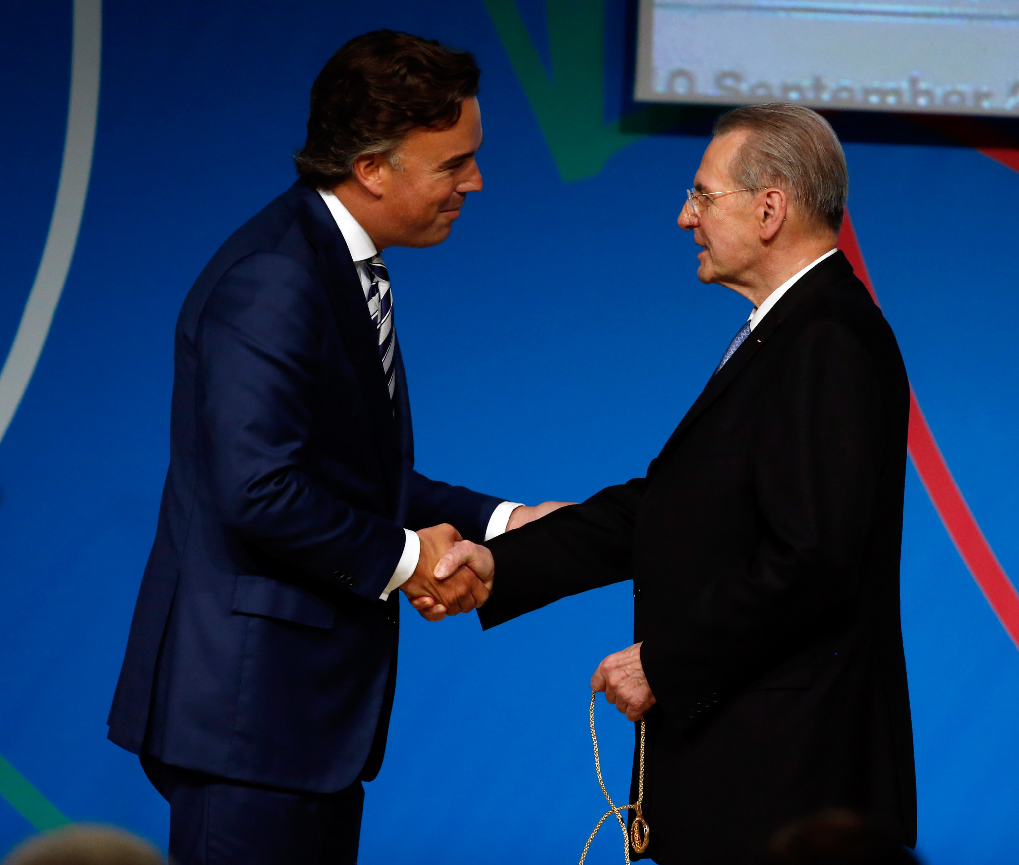 Camiel Eurlings, left, pictured being sworn in as an IOC member in one of Jacques Rogge's final acts as IOC President before being replaced by Thomas Bach in 2013 ©Getty Images