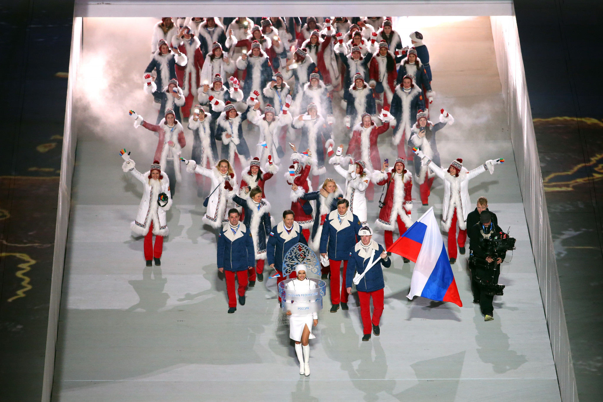 Alexander Zubkov, who has since been disqualified for doping, pictured carrying the Russian flag at the Opening Ceremony of Sochi 2014 ©Getty Images
