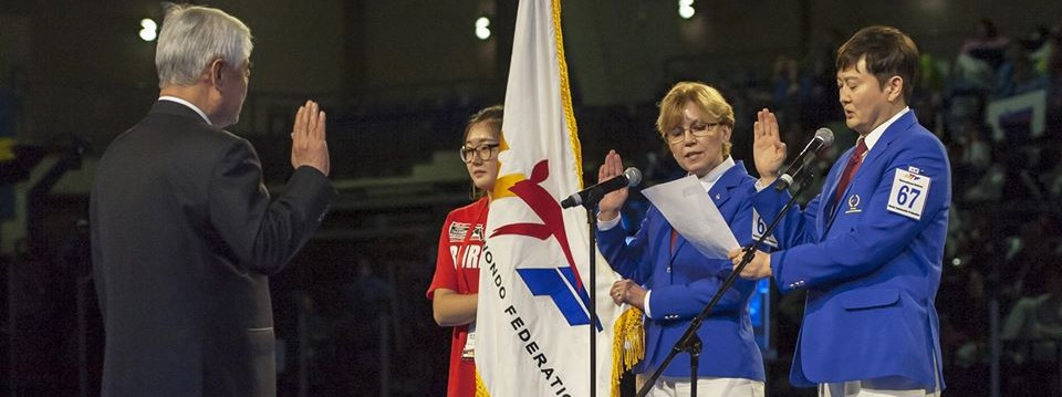 canada's Barbara Marian, centre, taking the referee oath at the Opening Ceremony of the 2016 World Junior Taekwondo Championships in Burnaby in her home country ©Taekwondo Canada