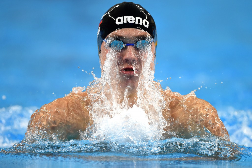 Russia's Anton Chupkov set a world junior record in the men's 100m breaststroke in the first session of the event