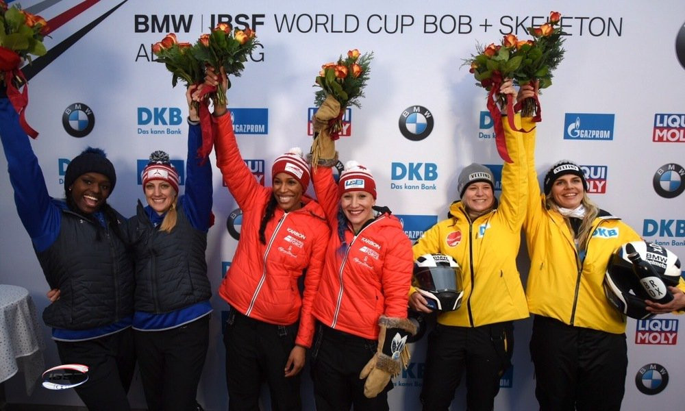 Kaillie Humphries and Phylicia George, centre, celebrate their victory today ©IBSF