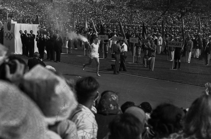 The teams line up as the Olympic Torch is borne towards the cauldron at the 1948 London Games - but there was no place for Germany, Japan or the Soviet Union... ©Getty Images