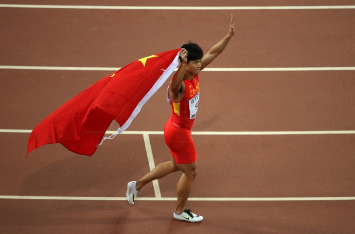 Bingtian Su acknowledges the applause from home fans after becoming the first Asian sprinter to reach a world 100m final ©Getty Images