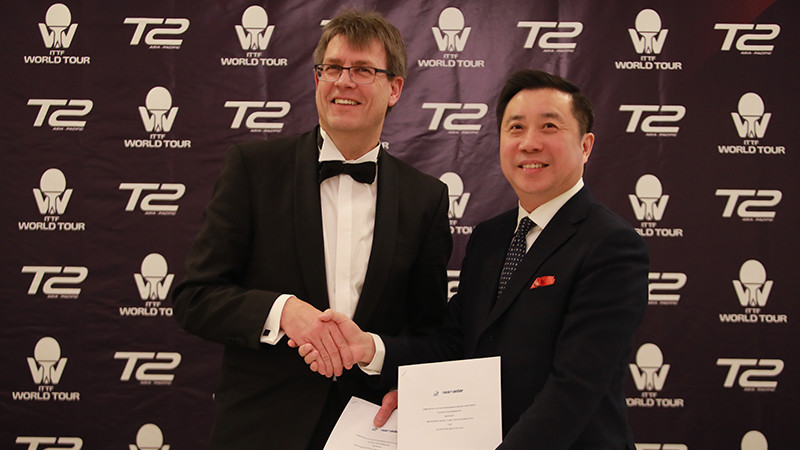 Thomas Weikert, left, and Frank Ji, have signed a collaboration agreement between the ITTF and T2 ©ITTF