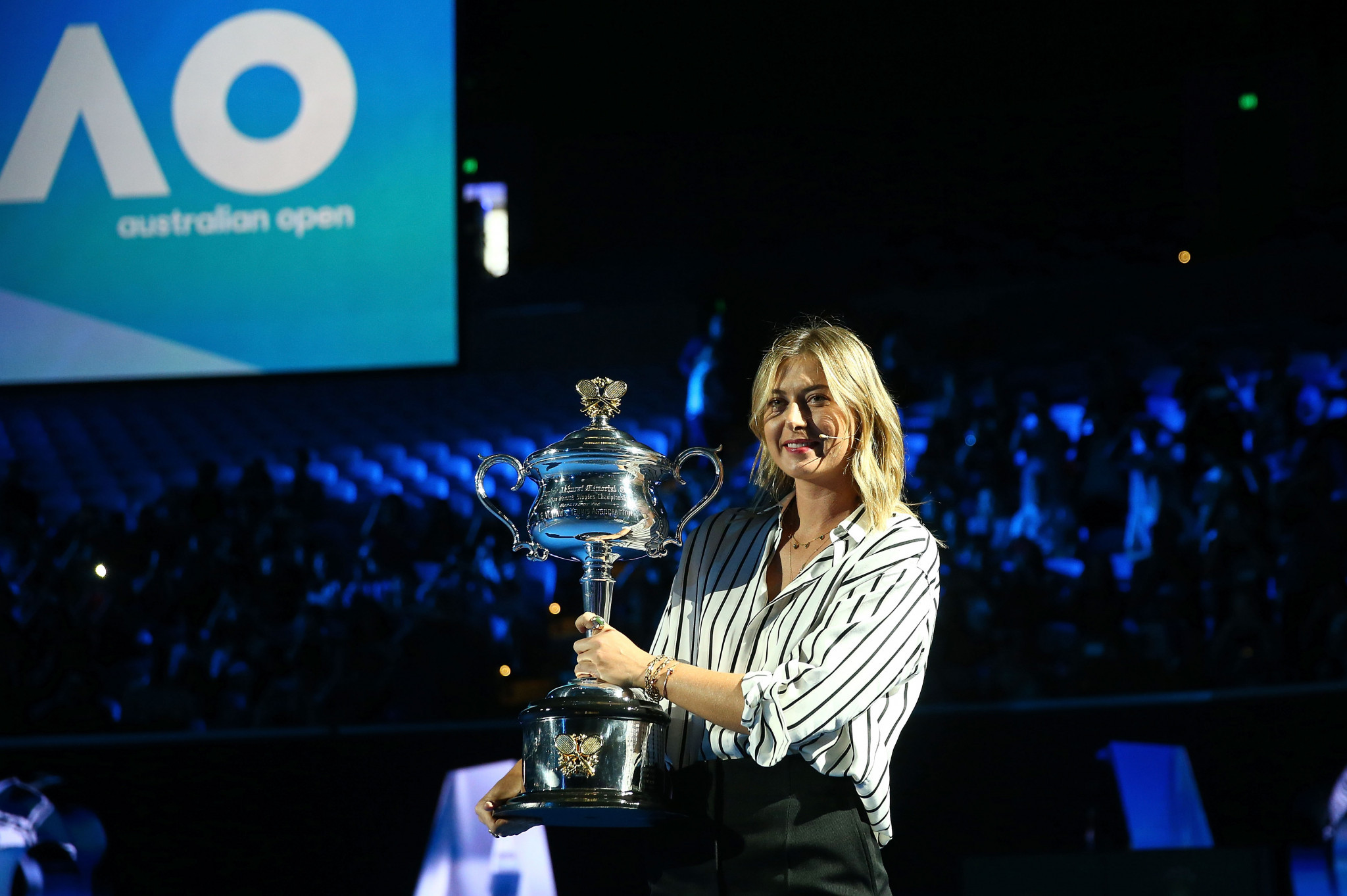 Maria Sharapova carried the women's Australian Open trophy at the draw ceremony ©Getty Images