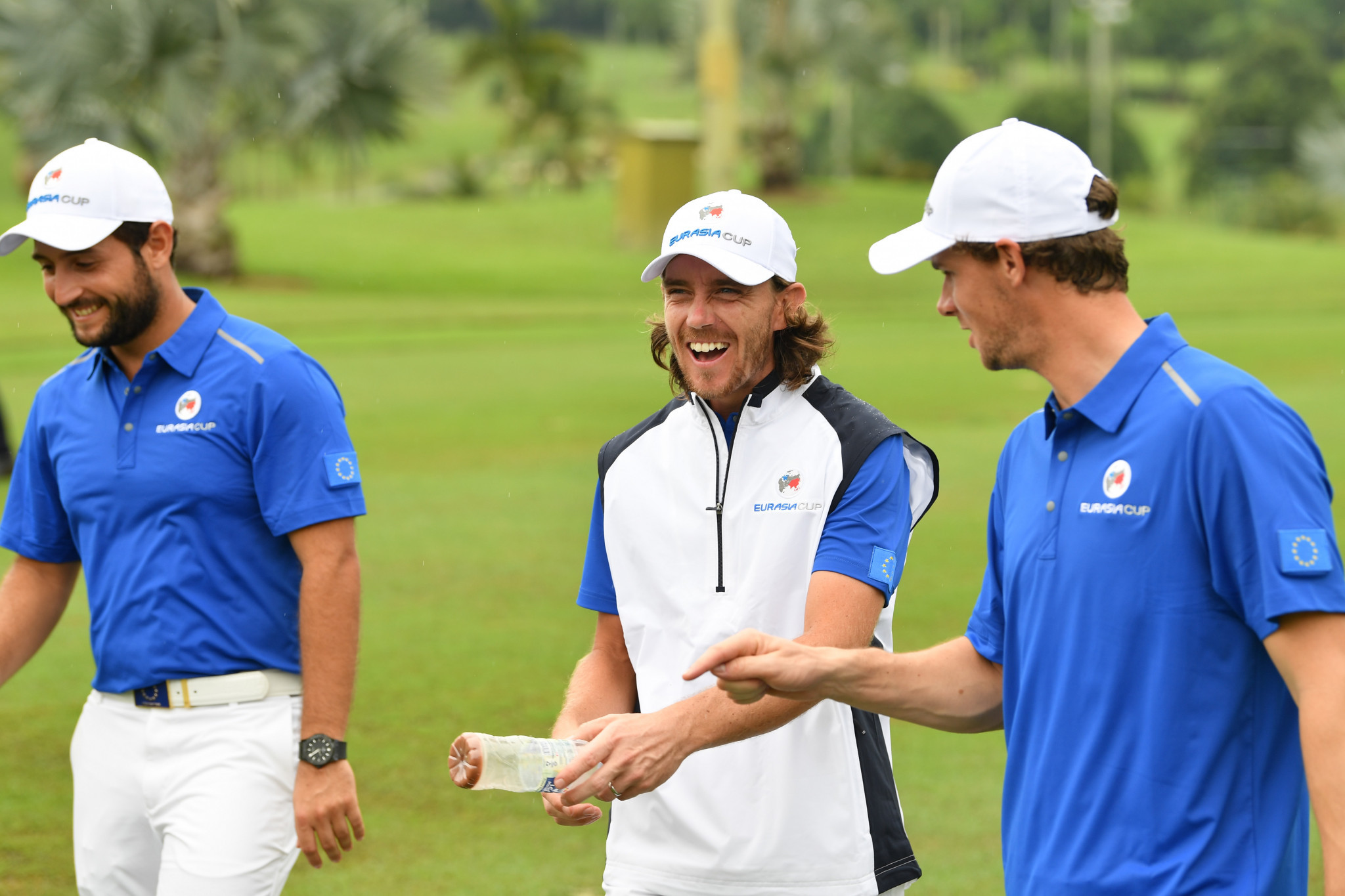 Tommy Fleetwood, of Europe, laughs with Alexander Levy and Thomas Pieters during the fourballs matches on day one of the 2018 EurAsia Cup in Kuala Lumpur, Malaysia ©Getty Images