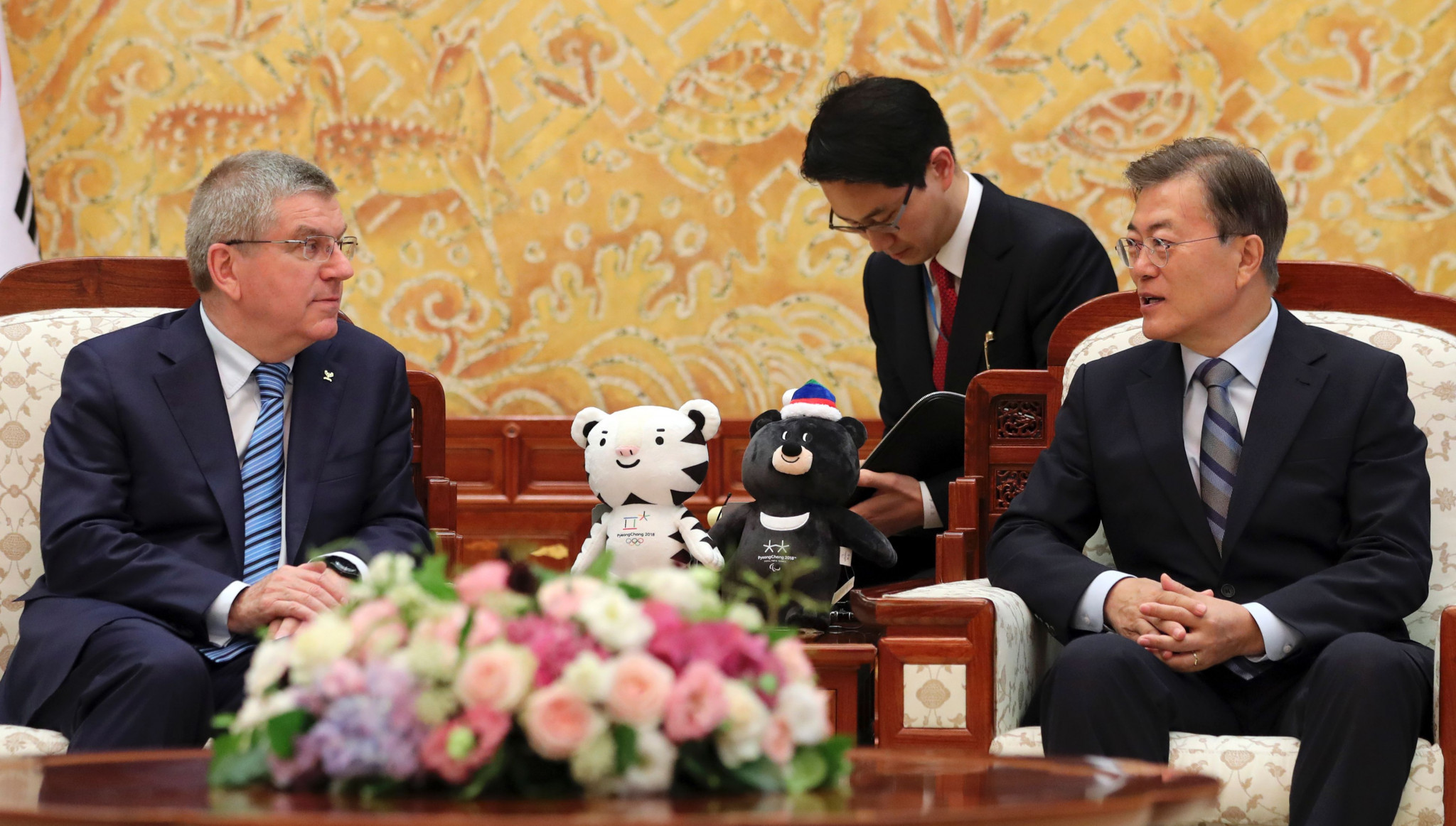The IOC and Thomas Bach, left, pictured meeting with South Korean President Moon Jae-in in July, have played a key role in fermenting the Korean Olympic detente behind the scenes ©Getty Images