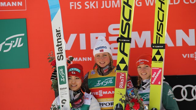 Maren Lundby, centre, won the Women's World Cup event ©FIS