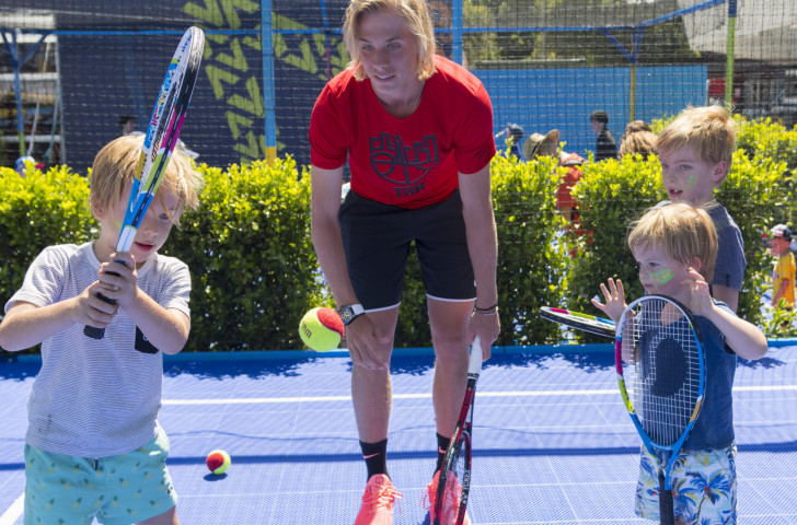 Canada's Denis Shapovalov playing tennis with children in the AO BallPark activities zone at the Australian Open, where learning and enjoyment are higher on the agenda than the desire to smash the opposition...©Getty Images