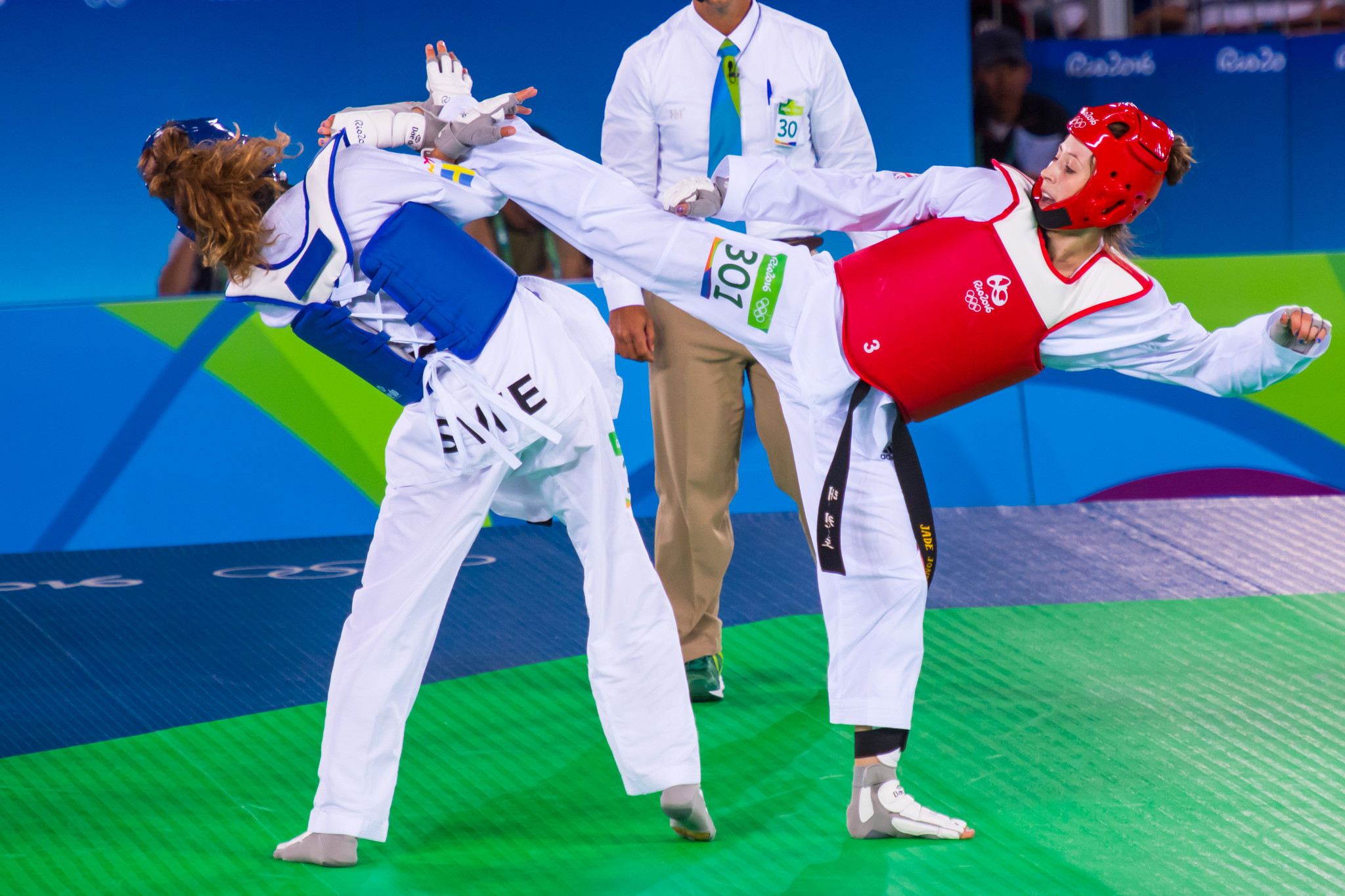 Jade Jones, right, pictured competing at the Rio 2016 Olympic en route to gold ©World Taekwondo
