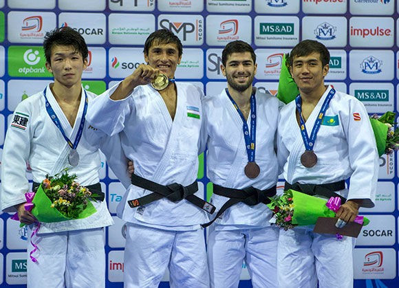 Shakhram Akhadov of Uzbekistan had to work harder than most for his gold medal as he sealed the men's under 66kg crown, beating Japan's Taroh Fujisaka, left, after seven minutes of a golden score ©IJF