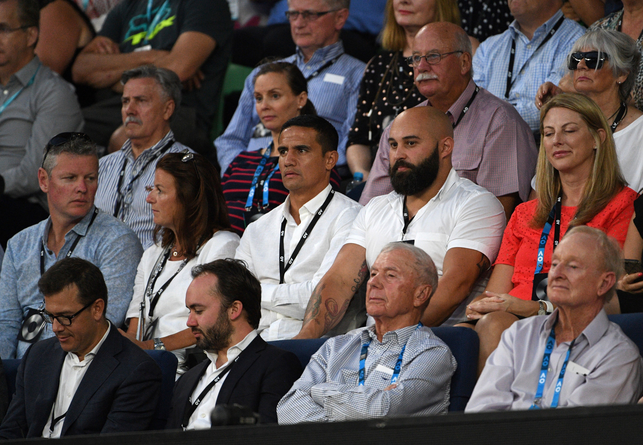 Legendary tennis player Rod Laver, front right, and football player Tim Cahill, second row, centre, were among top Australian sportsmen watching the tennis today ©Getty Images