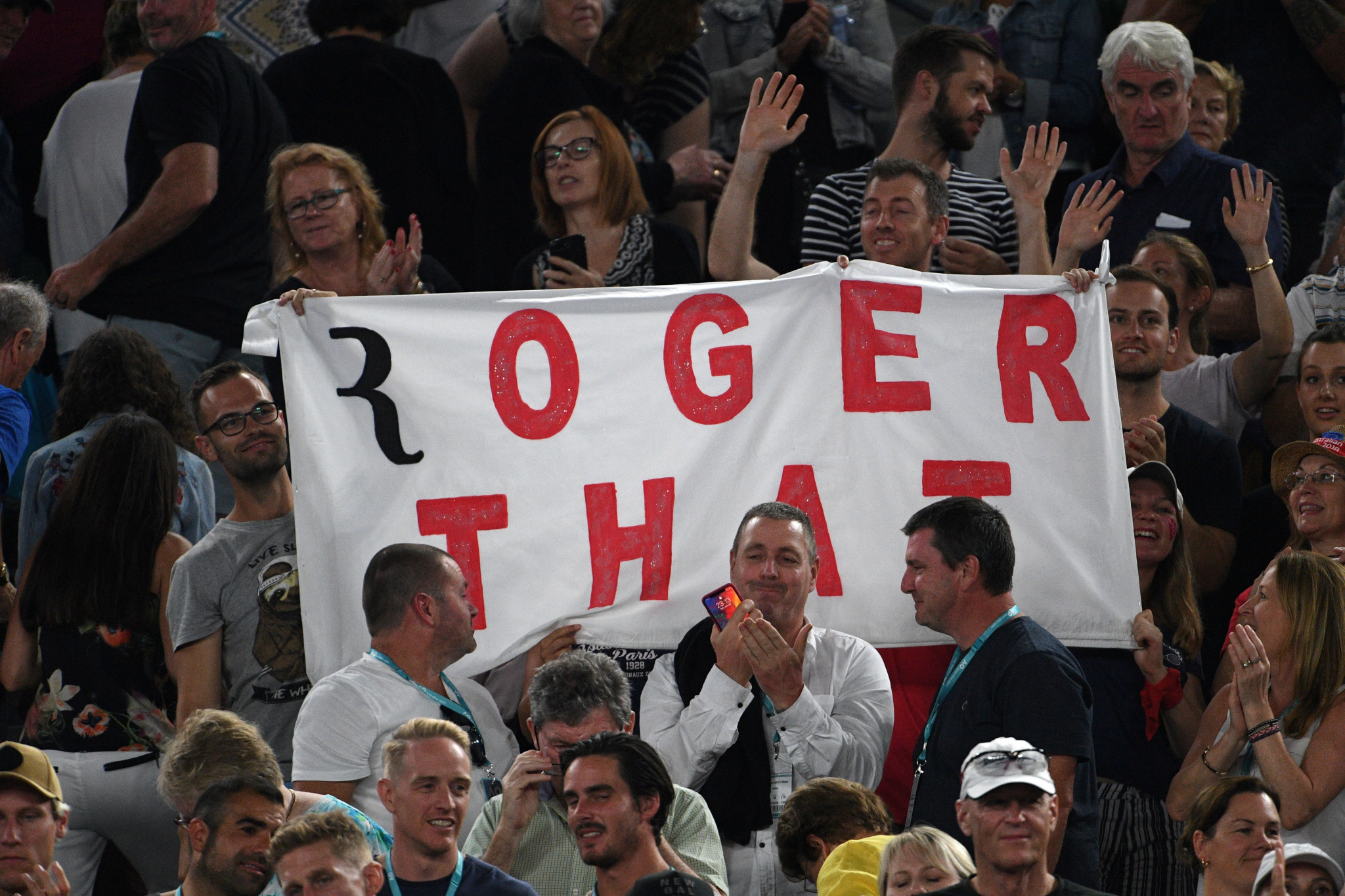Spectators display a banner in support of Roger Federer ©Getty Images
