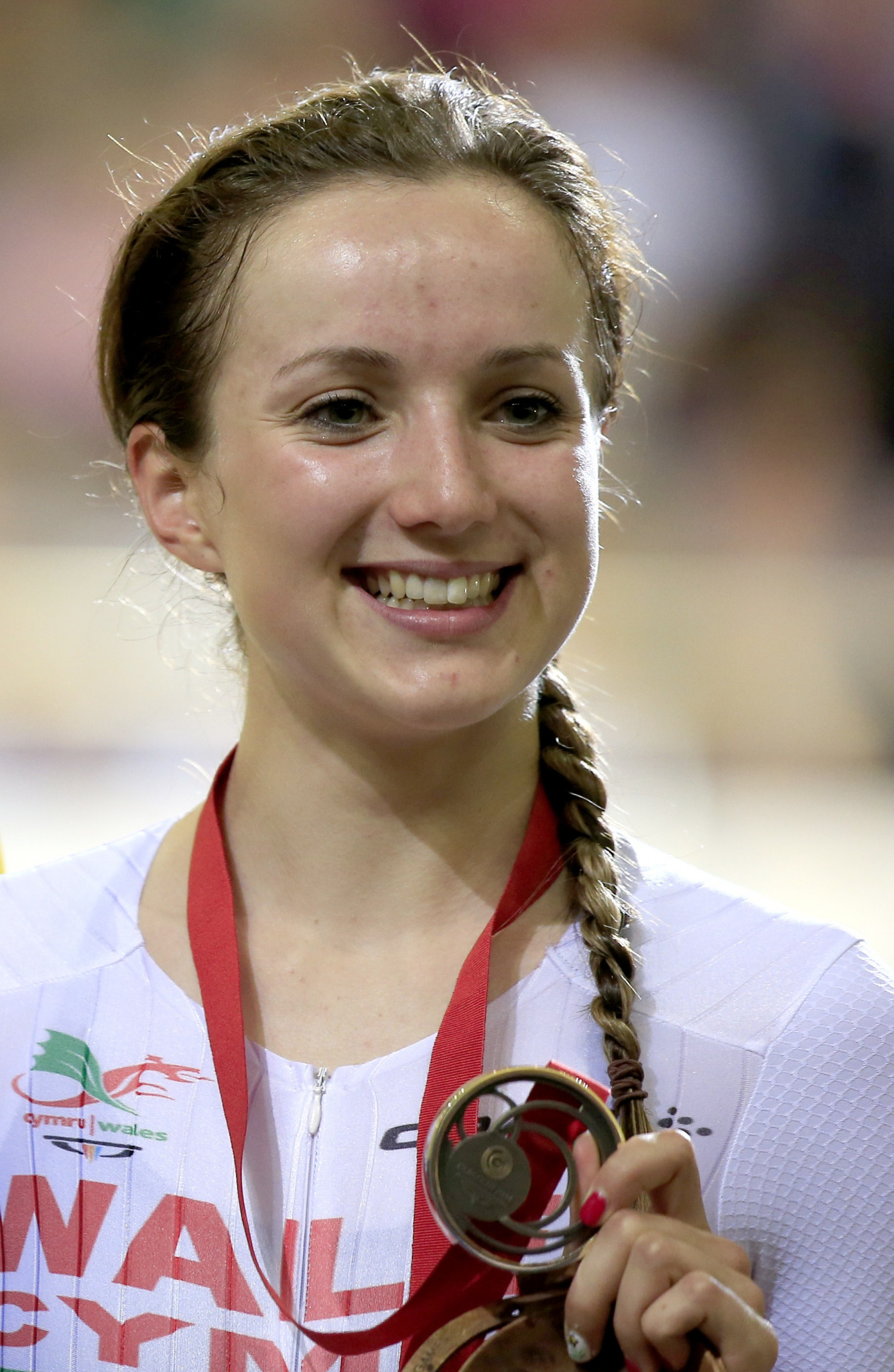 Cyclist Elinor Barker, pictured celebrating a bronze medal at Glasgow 2014, is one of 93 athletes announced by Wales today for Gold Coast 2018 ©Getty Images