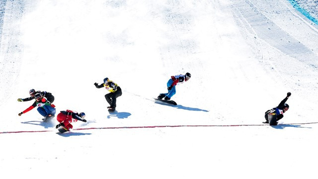 Christopher Robanske of Canada, right, signals a win in the sprint snowboard cross World Cup race in Bansko - but he has been beaten to the line by France's Olympic and world champion Pierre Vaultier, second left ©FIS