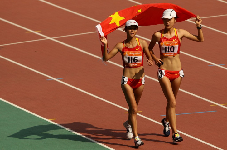 China's Liu Hong (right), who earned her country's first gold in the women's 20km race walk, celebrates with silver medallist  Xiuzhi Lu ©Getty Images
