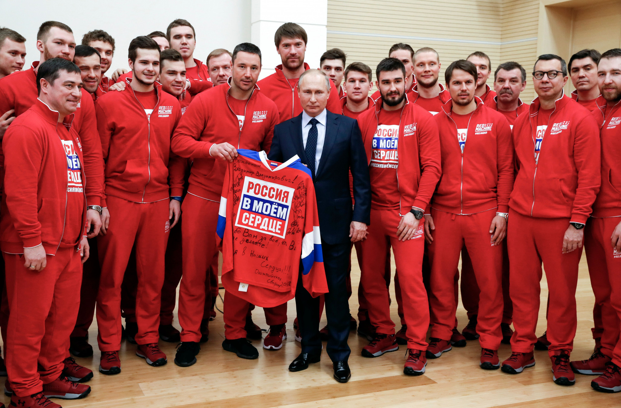 President Vladimir Putin, centre, apologised to Russia athletes for not protecting them more from the doping scandal when he met some of them due to compete under the OAR banner at Pyeongchang 2018 ©Getty Images