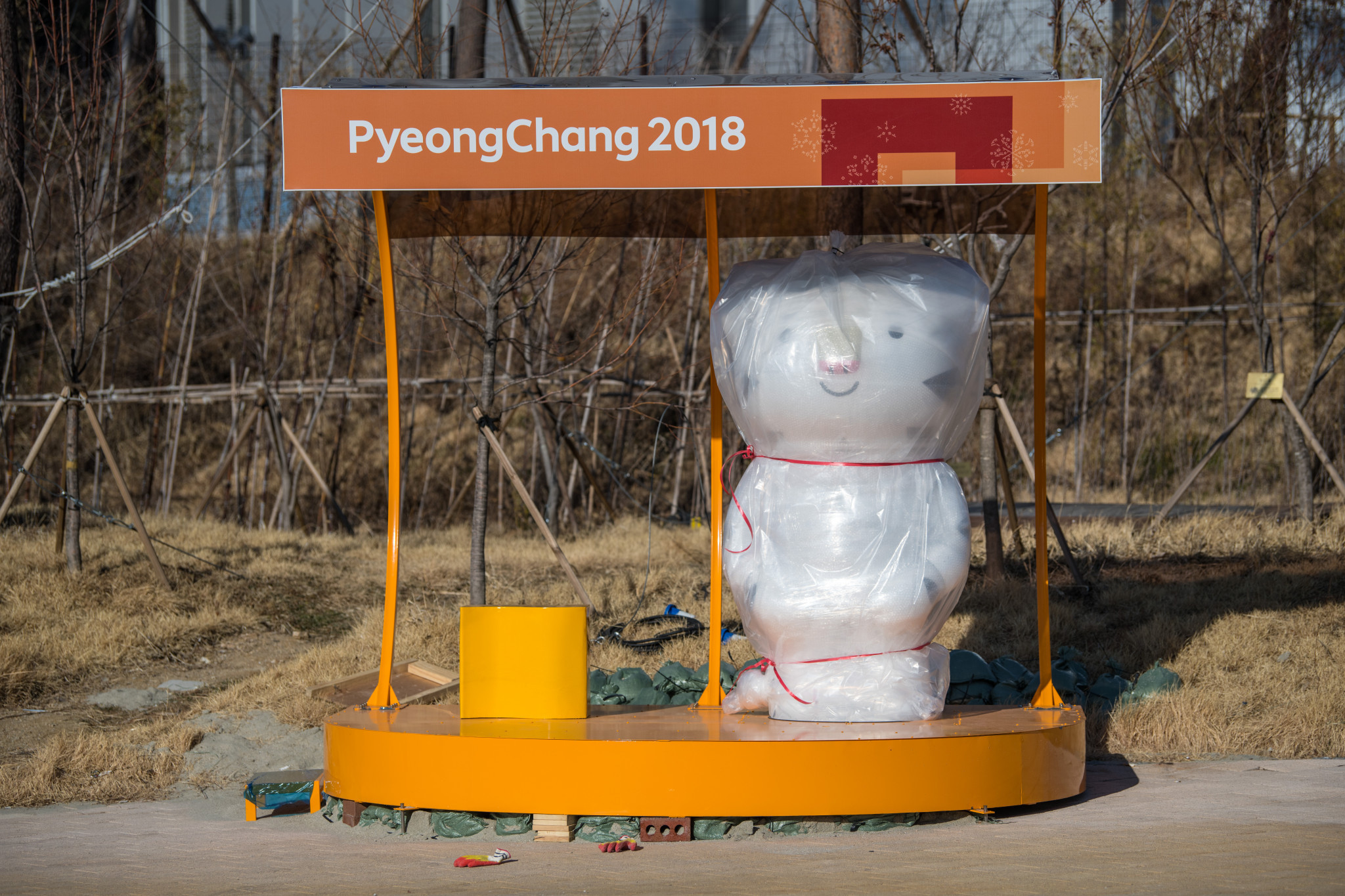 A Games mascot waits to be unwrapped in the Gangneung Coastal Cluster ©Getty Images