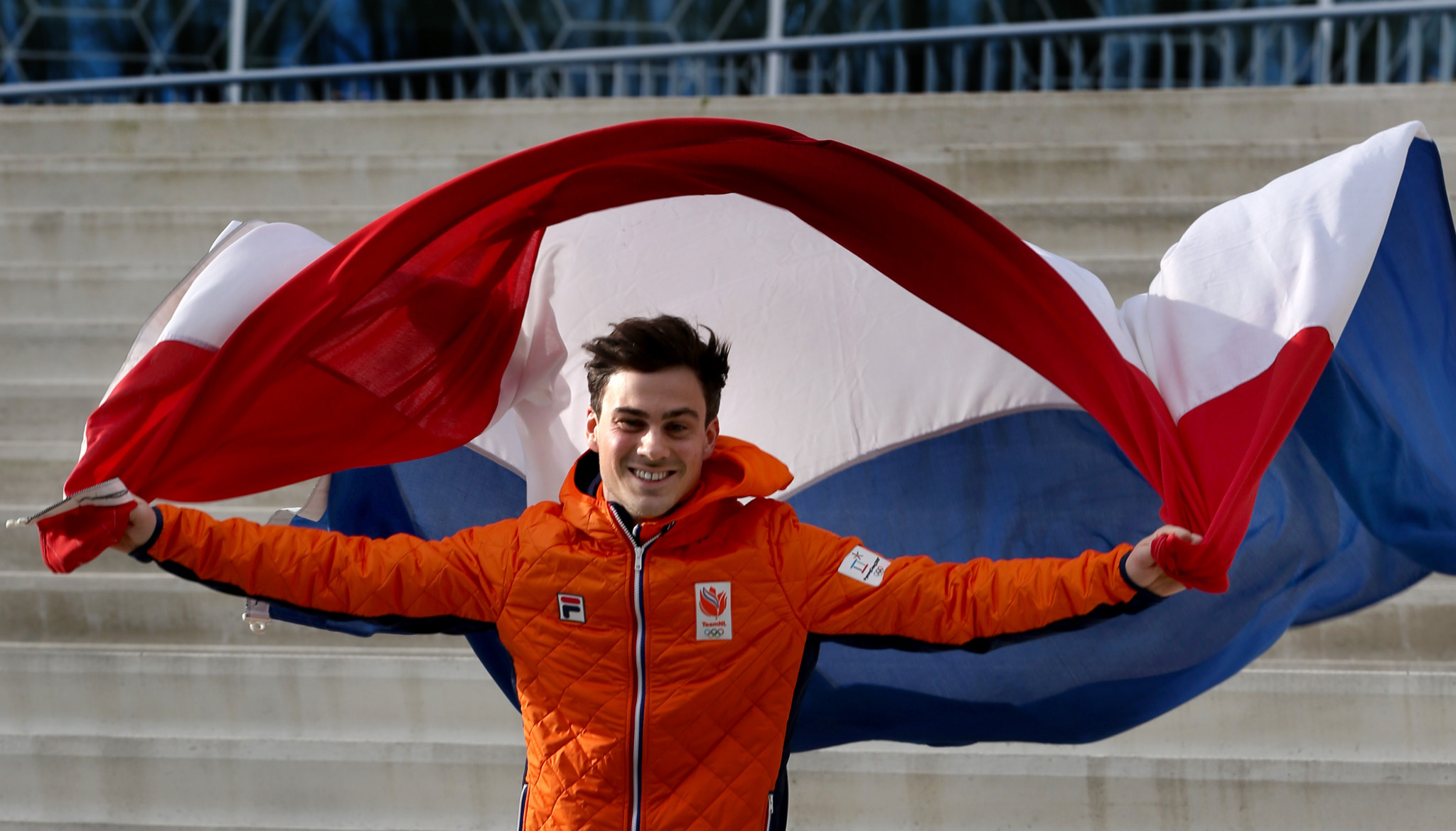 Dutch speed skater Jan Smeekens poses with his country's flag after being selected as flagbearer  ©Getty Images