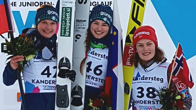 Slovenia's Nika Kriznar, centre, won gold in the women's individual normal hill ski jumping event ©FIS