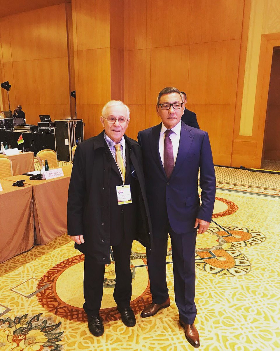Garuf Rakhimov, right, poses with a delegate after being chosen as Interim President of AIBA in Dubai at an Extraordinary Congress but the IOC are concerned because the Uzbek has been linked to organised crime ©Twitter