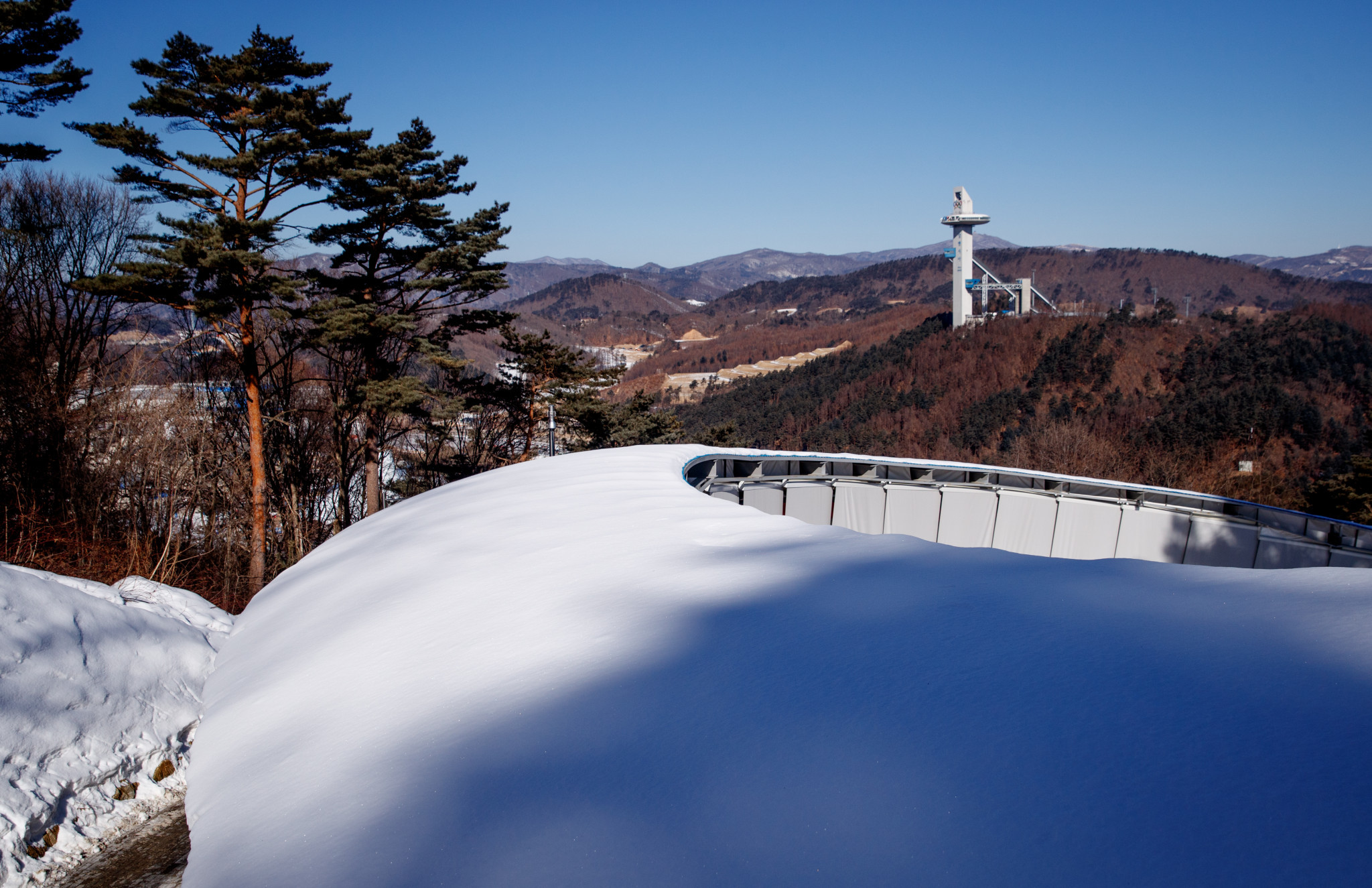 The Olympic Sliding Centre with the ski jumping tower in the background ©Getty Images