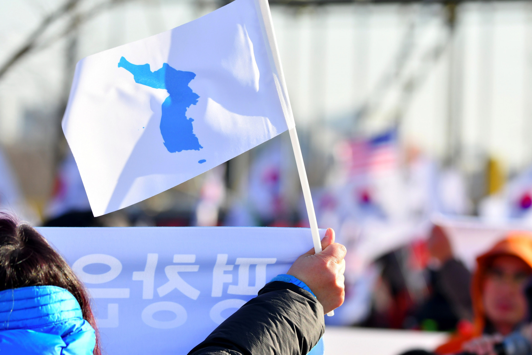 A spectator waving the unified Korean flag in Incheon yesterday before their women's ice hockey team played Sweden in a warm-up match for Pyeongchang 2018 ©Getty Images