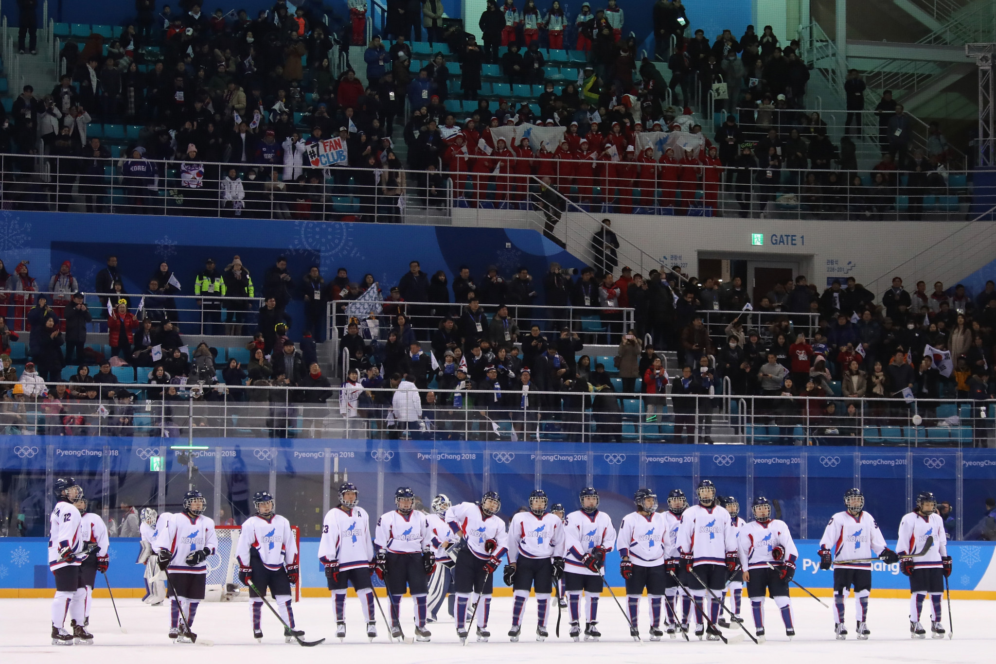 South and North Korean politicians unite as women's ice hockey team bring hope of peace despite defeat 