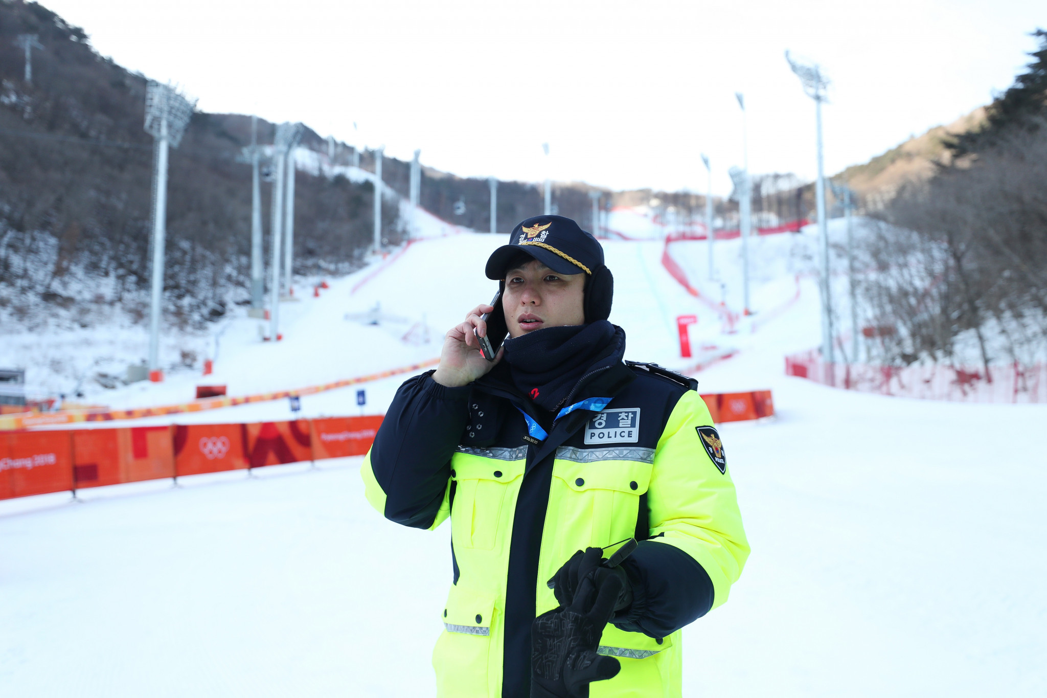 Police offices stand guard after the cancellation of the downhill skiing today ©Getty Images