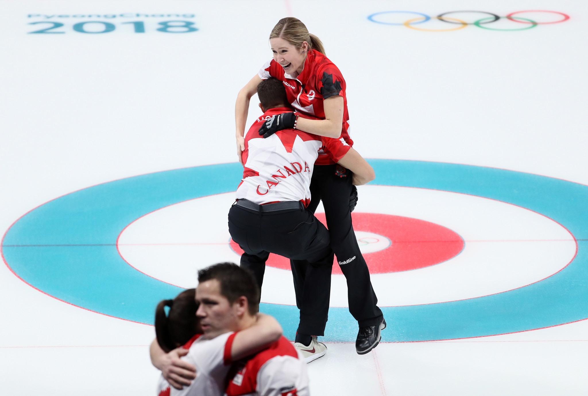 Canada celebrate winning the first ever mixed doubles curling title ©Getty Images