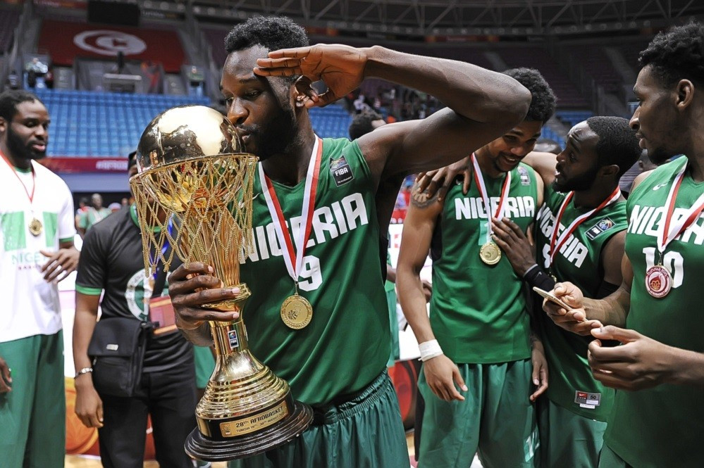 Chamberlain Oguchi holds the AfroBasket trophy after being named as the tournament's MVP ©FIBA