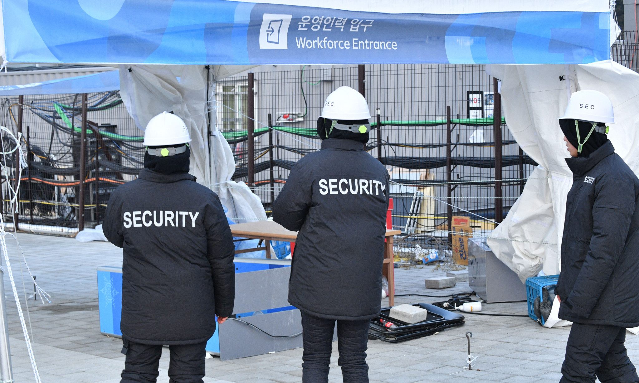 Security guards watch on at a windy Gangneung Olympic Park ©Getty Images