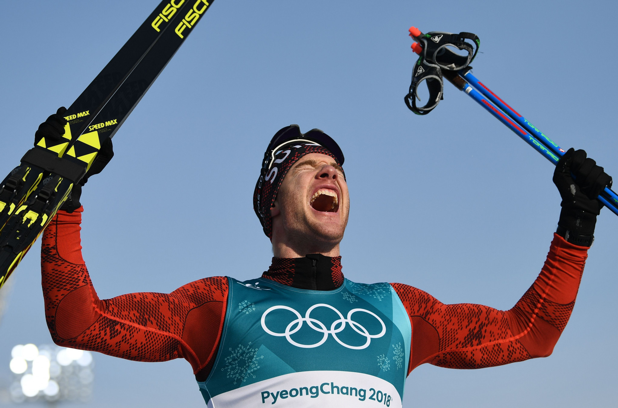 Cologna wins third successive Winter Olympic 15km cross country title