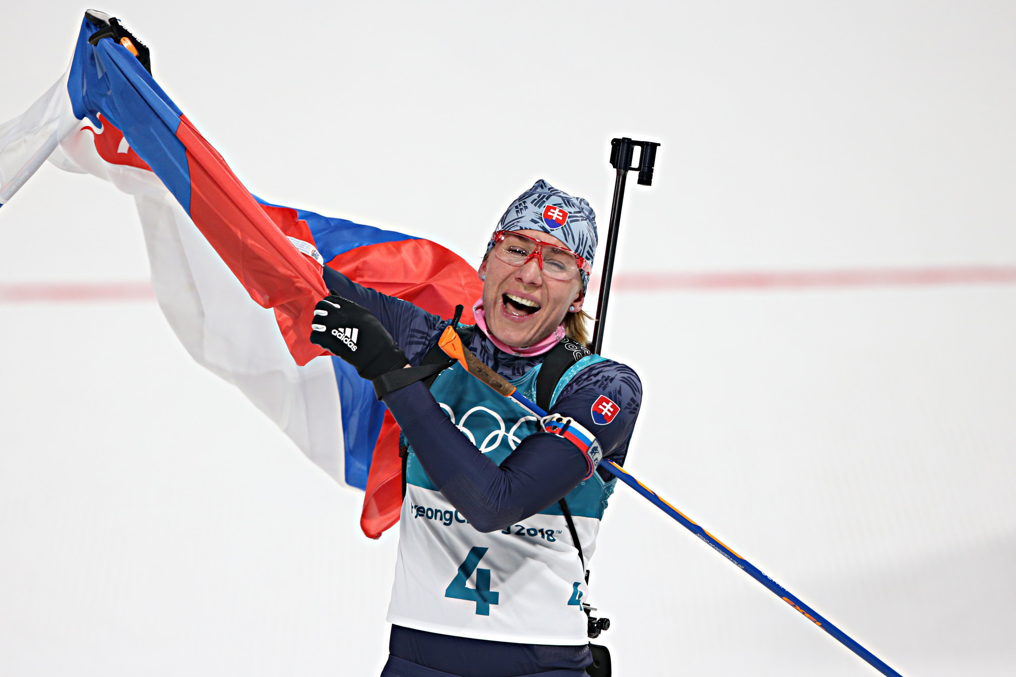Kuzmina becomes first biathlete to win gold medals in individual events at three consecutive Olympics