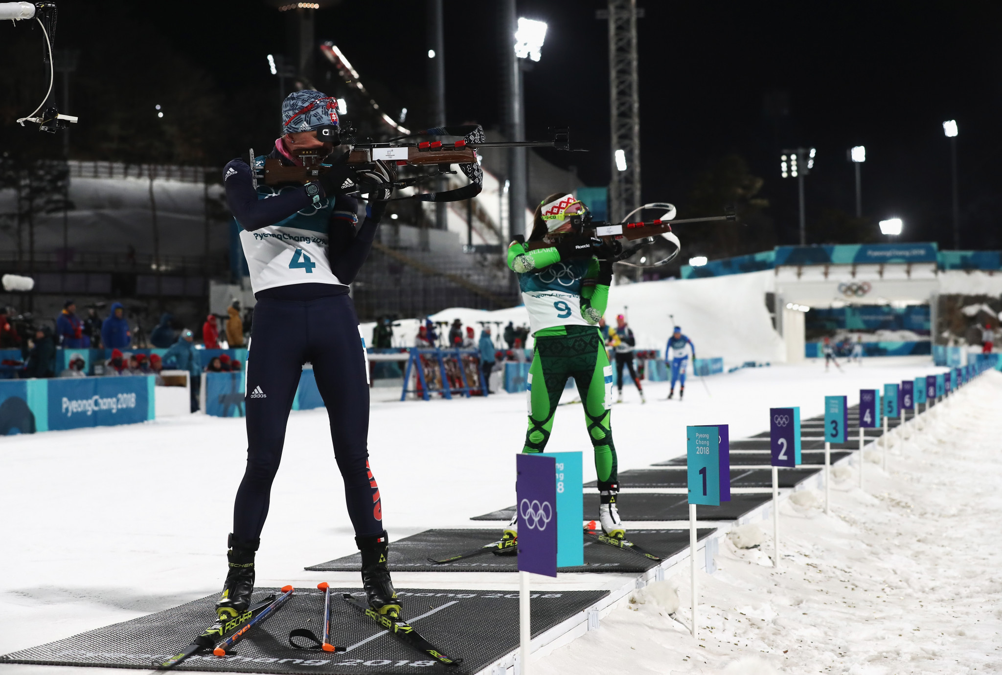 Anastasiya Kuzmina, left, show flawlessly across the first three rounds of shooting ©Getty Images