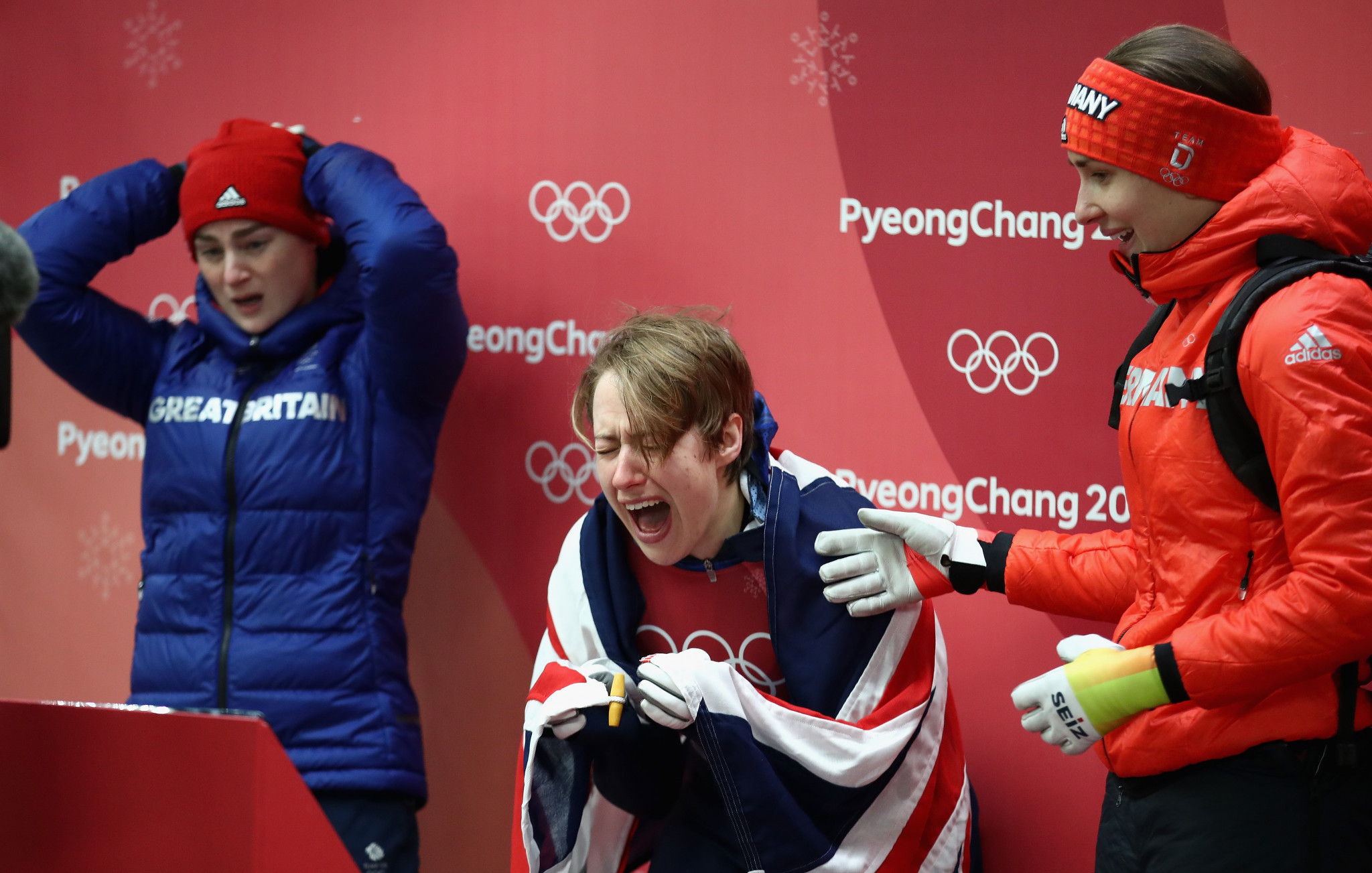 Britain's Lizzy Yarnold celebrates after realising she has become a double Olympic champion ©Getty Images