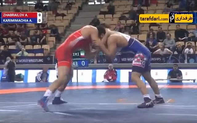 Iran's Alireza Karimi leading his match against Russia’s Alikhan Zhabrailov 3-2, when his coach can be heard from the sidelines instructing him to lose at the 2017 Under-23 World Championships in Bydgoszcz ©YouTube