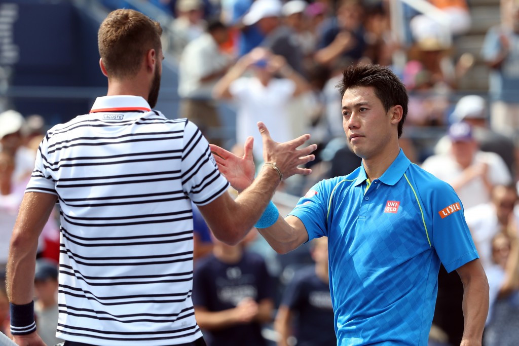 Kei Nishikori (right) was a big name casualty at the US Open after losing to Benoit Paire ©Getty Images