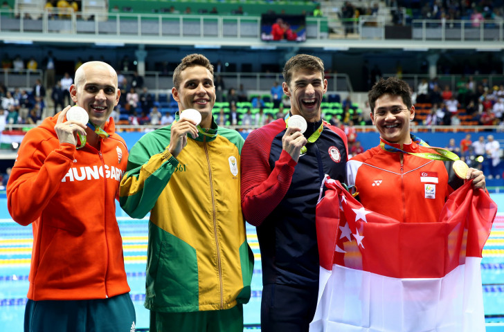 Joint silver medallists László Cseh of Hungary, Chad Le Clos of South Africa and Michael Phelps of the United States pictured with Singapore winner Joseph Schooling after the Rio 2016 men's 100m butterfly ©Getty Images