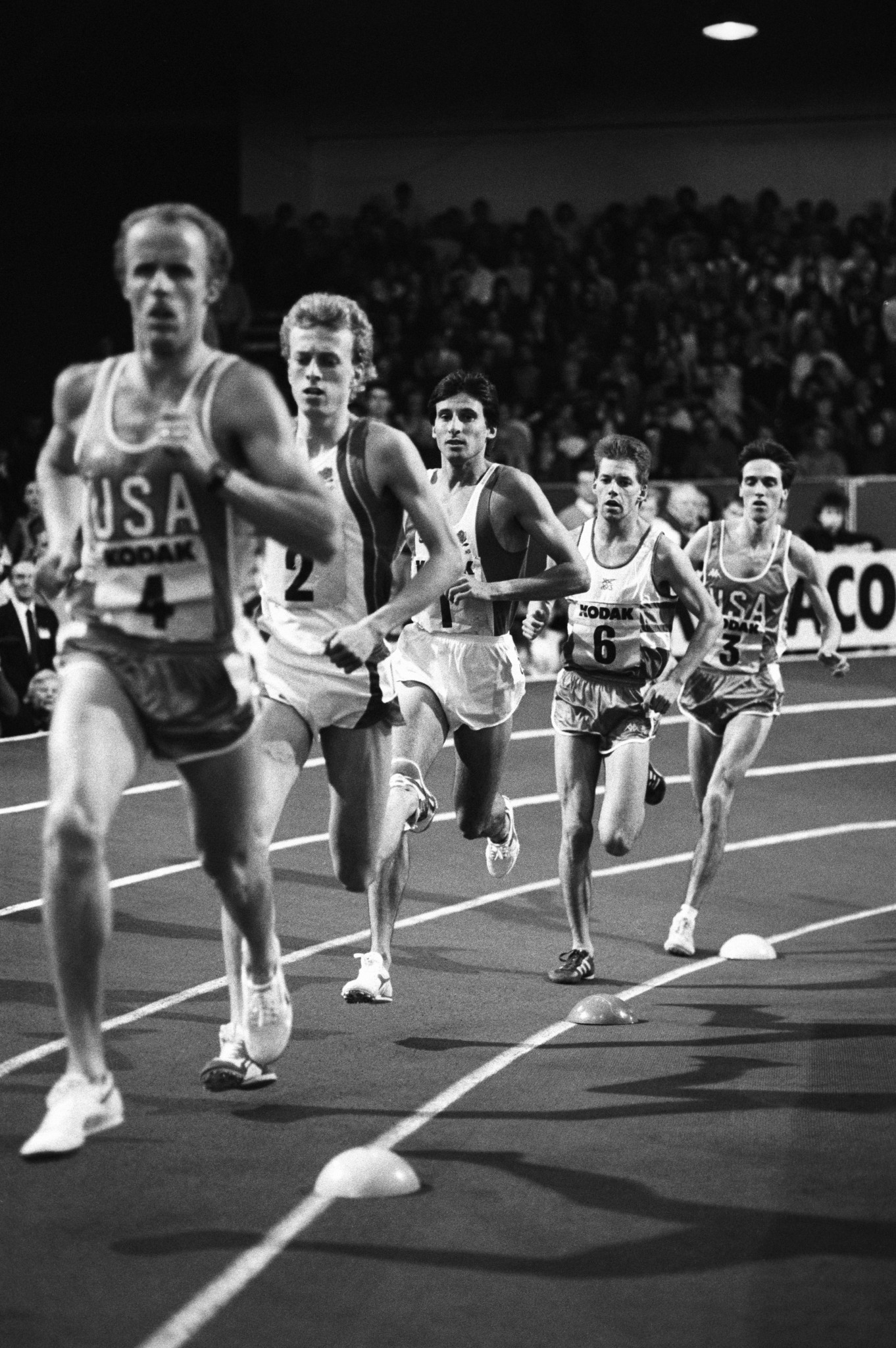 Sebastian Coe, pictured centre running for Britain against the United States in 1988 at the RAF Cosford track on which he set world indoor 800m records in 1981 and 1983 ©Getty Images