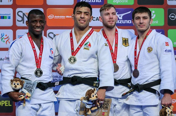 Iran's Saeid Mollaei, second left, won his first international title in the under 81kg class ©IJF.