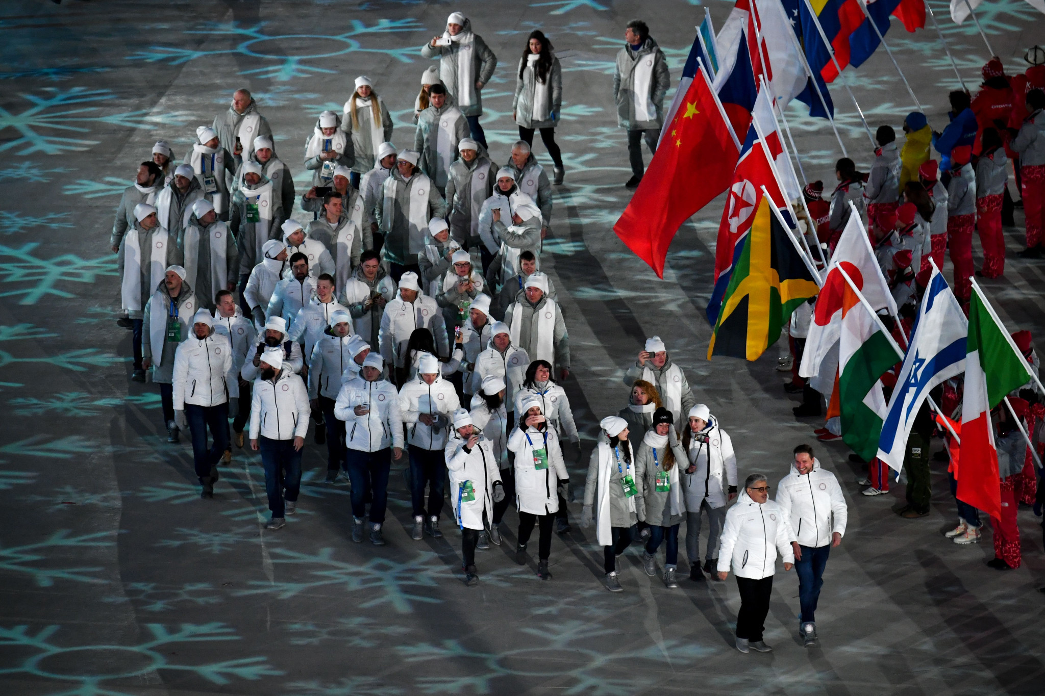 Russian athletes march at the Closing Ceremony under the Olympic flag, and the Olympic Athletes from Russia team name ©Getty Images
